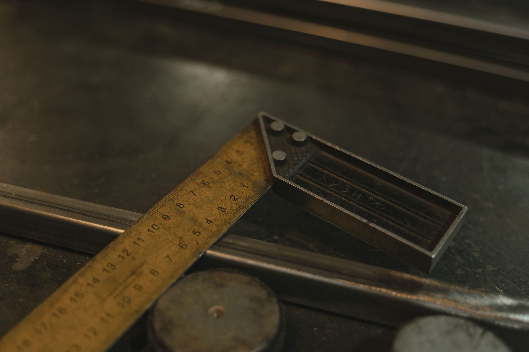 A combination square on a workbench